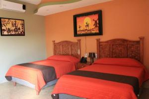 Postel nebo postele na pokoji v ubytování HOTEL RESTAURANTE TEQUILA