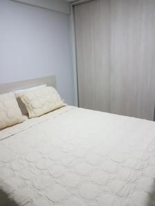 Cama o camas de una habitación en Apartamento Excelente Tambaú