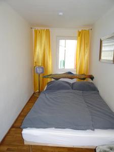 A bed or beds in a room at Apartment Center
