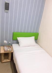 Postel nebo postele na pokoji v ubytování Carlsun Hotel