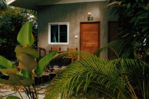 a house with plants in front of it at Le Pes Villas in Khanom