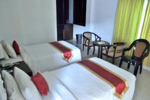 Llit o llits en una habitació de Inani Royal Resort