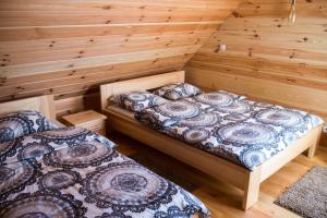 Postel nebo postele na pokoji v ubytování Wrzosowe Zacisze