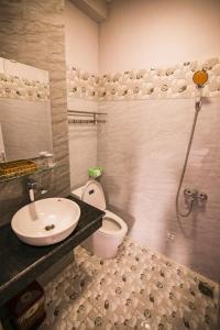 a bathroom with a sink and a toilet at SUNNY HOTEL in Quy Nhon