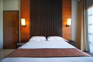Una cama o camas en una habitación de Sari Ater Hotel & Resort