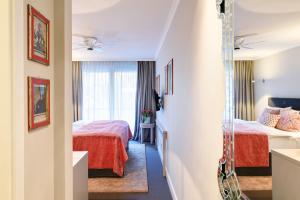 Postel nebo postele na pokoji v ubytování Hotel Admiral