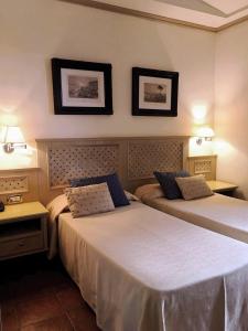 Postel nebo postele na pokoji v ubytování Hotel Quadrifoglio by Mancini