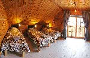 מיטה או מיטות בחדר ב-Liptov Lodge