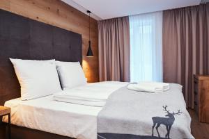 Postel nebo postele na pokoji v ubytování Ötztal Residenz