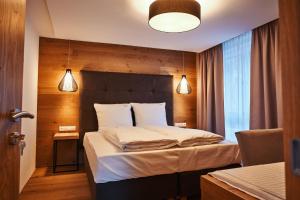 Postel nebo postele na pokoji v ubytování Ötztal Residenz