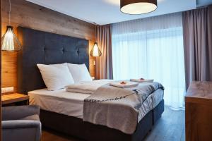 Postel nebo postele na pokoji v ubytování Ötztal Residenz