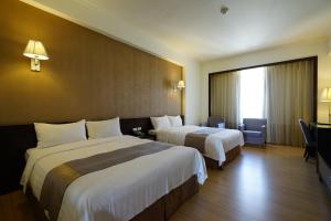 Postel nebo postele na pokoji v ubytování Hai Yue Hotel + 18 fotografií