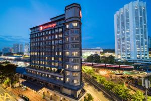 a tall building with a clock on top of it at Travelodge Kuala Lumpur City Centre in Kuala Lumpur