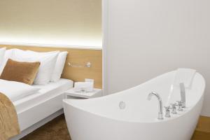 Postel nebo postele na pokoji v ubytování Hotel Waldegg - Adults only