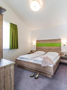 Katil atau katil-katil dalam bilik di Fuchs Apartments - inklusive Eintritt in die Alpentherme Gastein