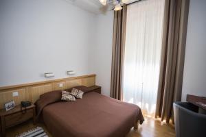 Cama o camas de una habitación en Hotel des Tourelles