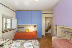 Кровать или кровати в номере Colle La Fosca - Casa panoramica