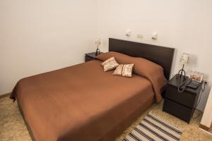 Cama o camas de una habitación en Hotel des Tourelles