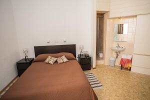 Cama o camas de una habitación en Hotel des Tourelles
