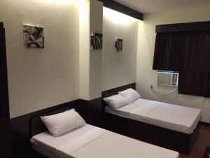 Tempat tidur dalam kamar di Z Pension