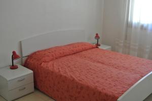 
Postel nebo postele na pokoji v ubytování Condominio LISA
