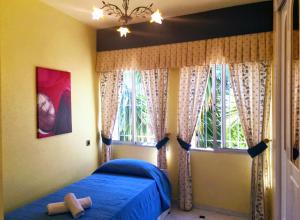 Giường trong phòng chung tại Villa Adela +32 ảnh