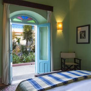 Un pat sau paturi într-o cameră la Riad Tamayourt Ocean View & piscine chauffée à 30