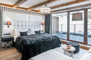 A bed or beds in a room at Aktiv- & Wellnesshotel Bergfried