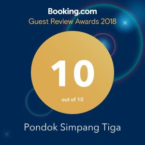 a poster for the guest review awards with a yellow circle at Pondok Simpang Tiga in Sabong