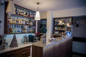 a bar with a christmas tree on the counter at Pensjonat pod Samowarem in Tylicz