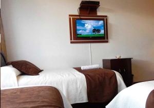 Letto o letti in una camera di La Merced Plaza Hospedaje
