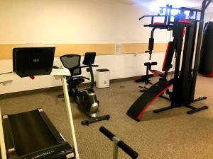 a room with several exercise equipment on the floor at Pensiunea Blue House in Murighiol