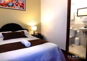 Letto o letti in una camera di La Merced Plaza Hospedaje
