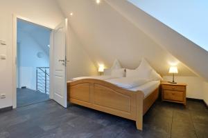 En eller flere senge i et værelse på Moselhof Ferienwohnungen