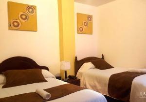 Letto o letti in una camera di La Merced Plaza Hospedaje