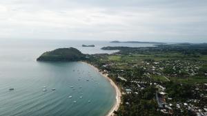 an aerial view of a beach with boats in the water at Coucher de Soleil in Ambatoloaka