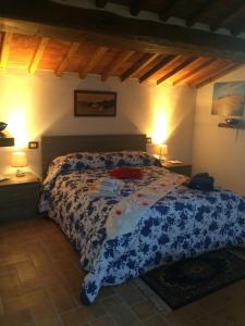 Cama o camas de una habitación en Mansarda degli Ulivi