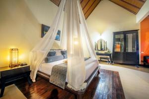 Postel nebo postele na pokoji v ubytování Chada Lanta Beach Resort - SHA Extra Plus