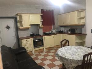 A kitchen or kitchenette at Entire B&B