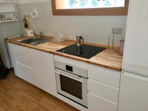 Kuchyň nebo kuchyňský kout v ubytování Casa del Quai