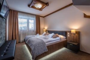 A bed or beds in a room at Apartmany Krasvill