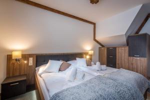 A bed or beds in a room at Apartmany Krasvill