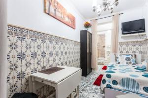a small room with a bed and a desk at Atalaia Place - Bairro Alto, Lisbon City Center in Lisbon
