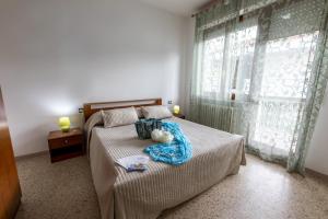 Ένα ή περισσότερα κρεβάτια σε δωμάτιο στο Edera 2 Silvi Vacanza