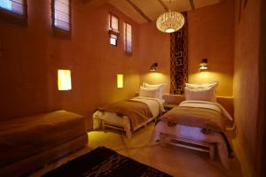Katil atau katil-katil dalam bilik di Riad Caravane