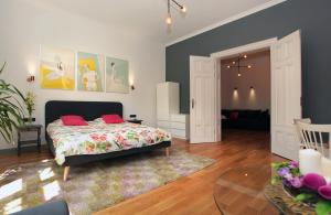 a bedroom with a bed and a living room at Sopot Ostsee Apartments in Sopot