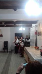 a group of people standing in a room taking a picture at Pensiunea Popan in Şieu
