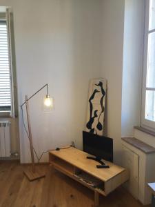 TV a/nebo společenská místnost v ubytování Delizioso Appartamento Centro Storico Lucca Comics