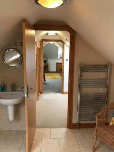 a bathroom with a sink and a mirror at Mooredge - Room only in Whitby +24 photos