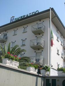 a hotel with flowerpots on the side of a building at Hotel Smeraldo in Lido di Camaiore